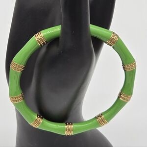 This Lilly Pulitzer bracelet is a green enamel bamboo-style bangle with gold